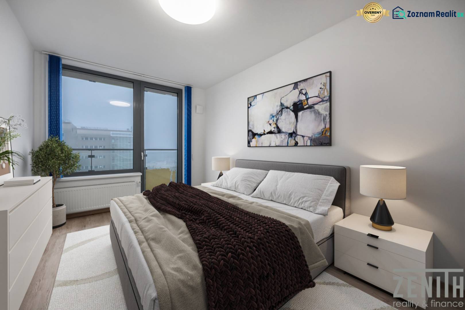 Ložnice v 2-pokojovém bytě s pohodlnou postelí, obrazem a lampou na nočním stolku.