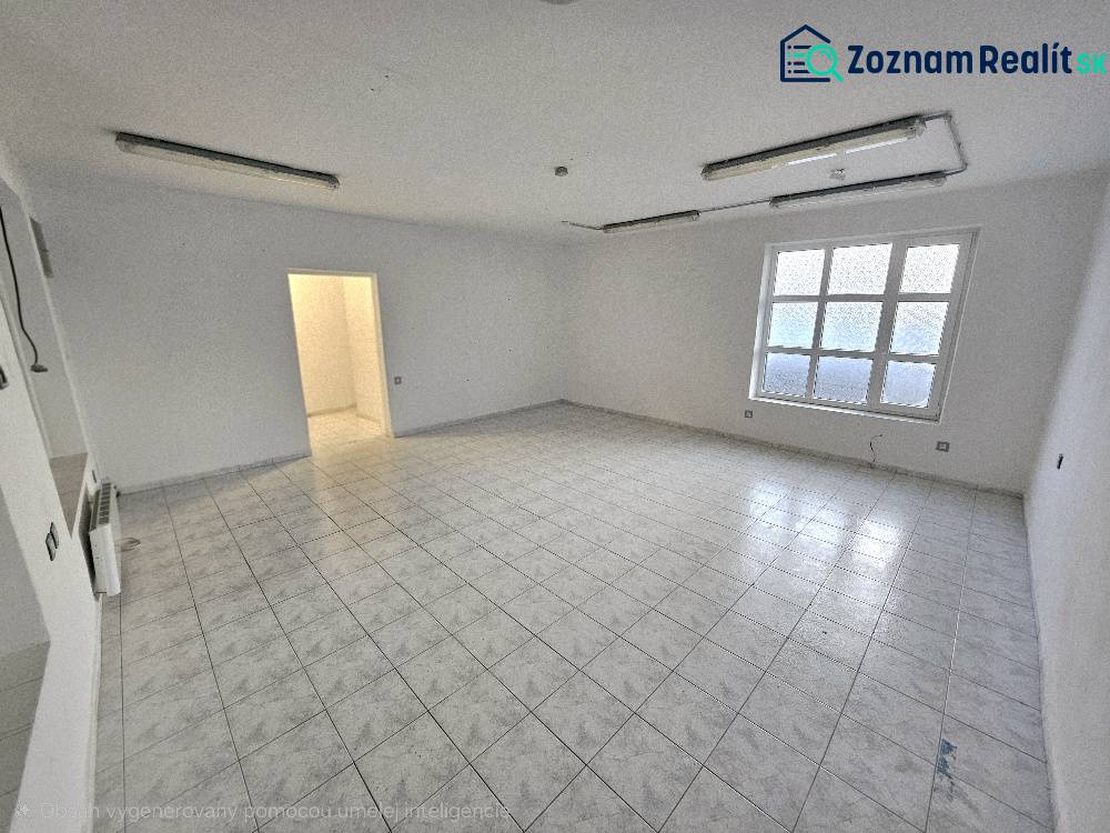 Prázdné obchodní prostory s dlažbou a oknem.