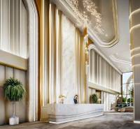 Luxusní vstupní hala s recepcí v rámci výstavby bytů, elegantní osvětlení.