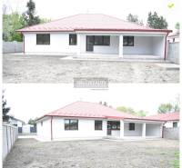 Rodinný dům v Závodě s červenou střechou, prostorným dvorem a krytou terasou.