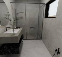 Koupelna s umyvadlem, sprchovým koutem a oknem v rodinném domě.