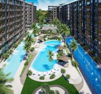 Výstavba bytů v Pattayi s bazény, terasami a palmami vytváří tropickou atmosféru.