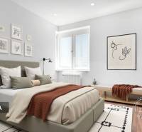 Ložnice v dvoupokojovém bytě s pohodlnou postelí, dekoracemi a podlahou s dřevěným dekorem.