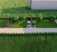 Letecký pohled na rodinný dům se dvěma auty a zeleným trávníkem.