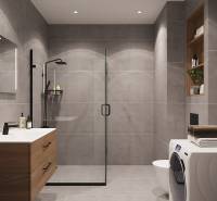 Koupelna se sprchovým koutem, umyvadlem, pračkou a poličkami v 1-pokojovém bytě.