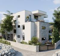 Rekreační apartmán v Murteru s kamennými detaily, obklopený stromy a přírodou.