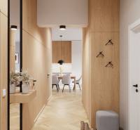 Chodba ve 4-pokojovém bytě s podlahou s dřevěným dekorem, vedoucí k jídelně.