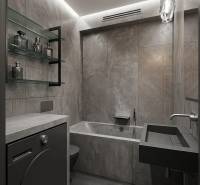 Stylová koupelna s tmavě šedými obklady v 2pokojovém bytě.