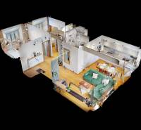 3D pohled na 3-pokojový byt s podlahou s dřevěným dekorem a zařízením.