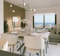 Jídelní část Rekreačního apartmánu s výhledem na moře a elegantním prostíráním.