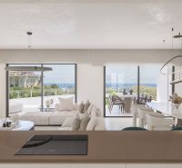 Obývací pokoj rekreačního apartmánu s výhledem na terasu a moře, světlé barvy.