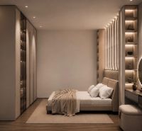 Ložnice s postelí a podlahou s dřevěným dekorem v rekreačním apartmánu.