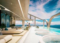 Střešní terasa s bazénem v rámci výstavby bytů v Pattayi, výhled na moře.