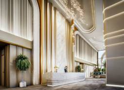 Luxusní vstupní hala s recepcí v rámci výstavby bytů, elegantní osvětlení.