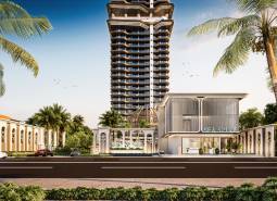 Výstavba bytů v Pattayi ukazuje výškovou budovu obklopenou palmami.