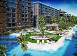 Výstavba bytů v Pattayi, bazény, palmy a prostorné společné prostory.