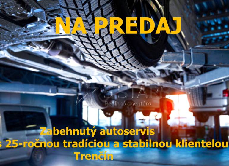 Interiér autoservisu s automobilem na zvedáku, prodej v Trenčíně, sklady a haly.