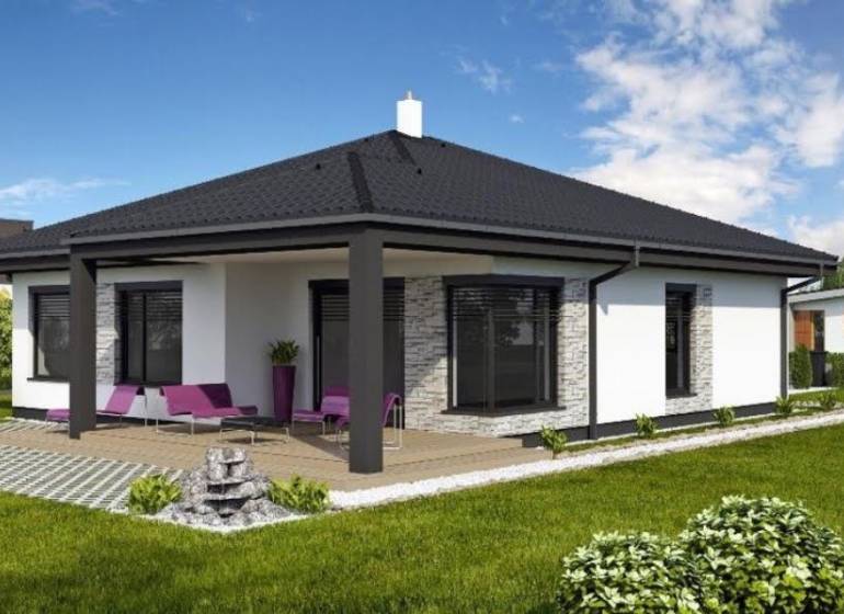 Rodinný dům v Mostě pri Bratislavě s terasou, trávníkem a venkovním posezením.