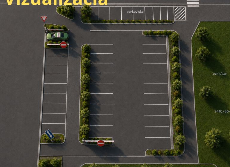 Parkoviště na Novozámocké ulici ve Zvolenu, Banskobystrický kraj, Slovensko obklopené zelení.
