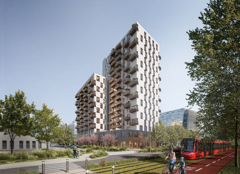 Novostavba s balkony, cyklista a tramvaj na Mlynských Nivách v Bratislavě-Ružinově.