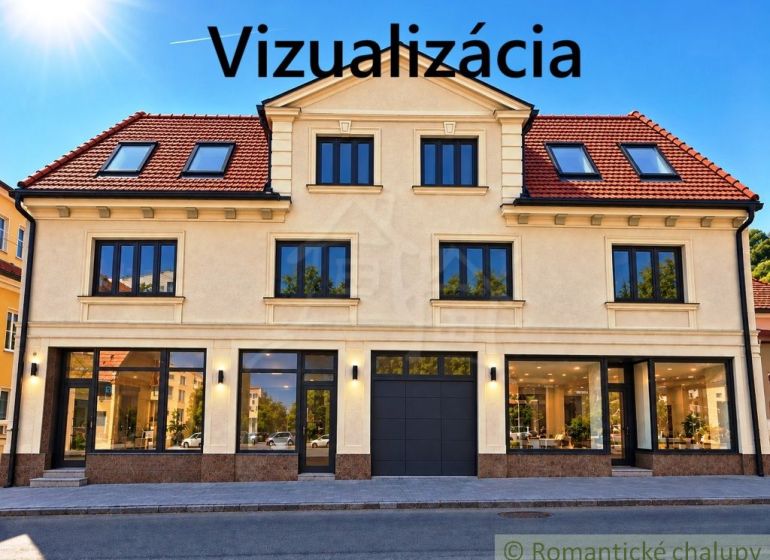 Fasáda budovy s obchodními prostory ve městě Modrý Kameň, zachycující prosklené výlohy.