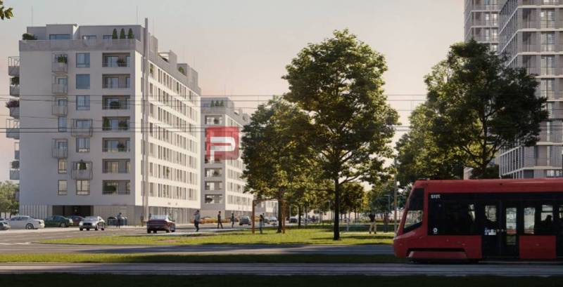 Budovy na ulici Labutí, Bratislava V, se zelení a tramvají v popředí.
