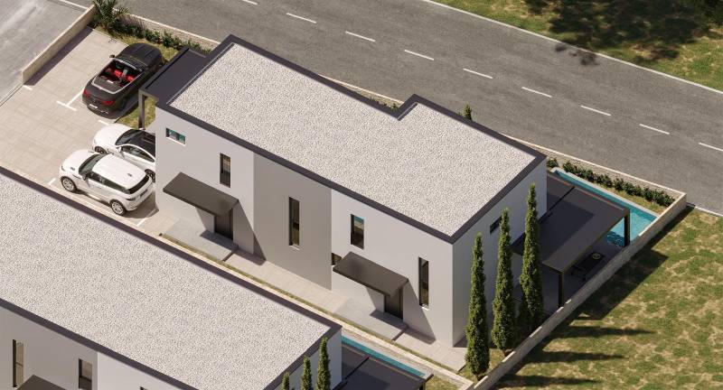 Pohled shora na 4pokojový byt v Mandre s parkovištěm a malým bazénem.