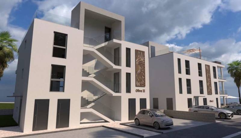 Moderní budova s parkovištěm a palmami ve městě Vir, zahrnující 2pokojový byt.