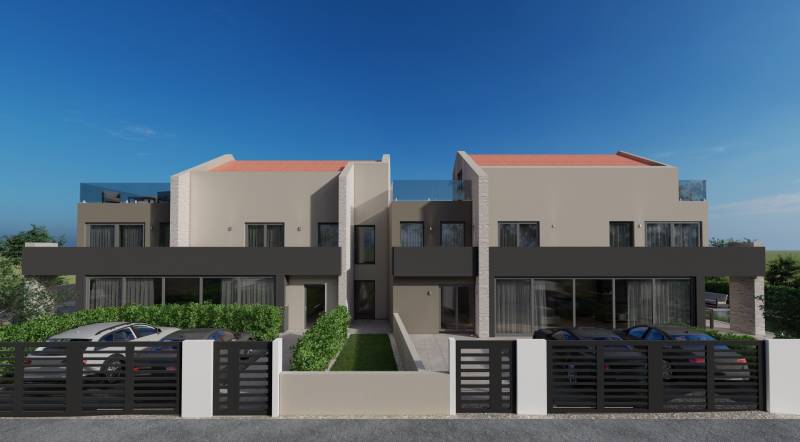 Vila v Poreči s moderní architekturou, před kterou je parkoviště a zeleň.