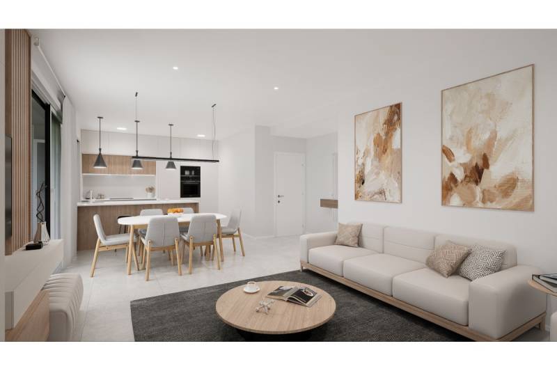 Interiér rekreačního apartmánu zahrnuje kuchyň, jídelní stůl, pohovku a dekorace.