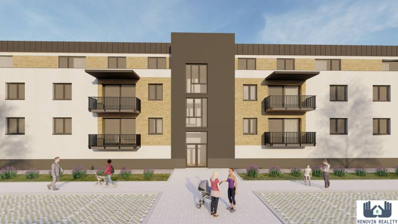 Výstavba bytů v Kriváni zahrnuje moderní budovu s balkony a zelení kolem.