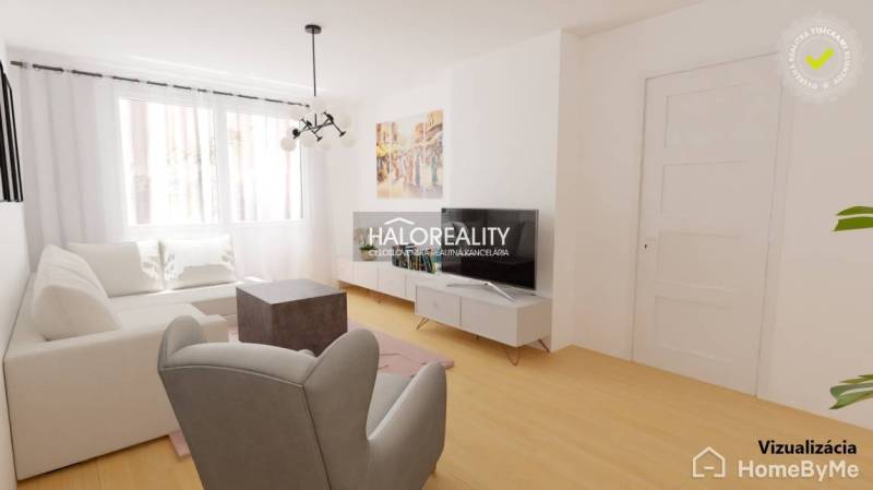 Obývací pokoj s bílým nábytkem a televizorem ve 3pokojovém bytě.