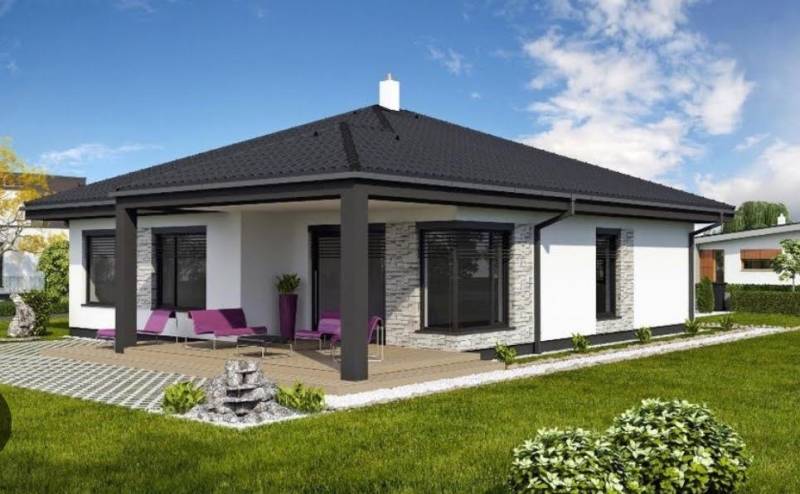 Rodinný dům v Mostě pri Bratislavě s terasou, trávníkem a venkovním posezením.