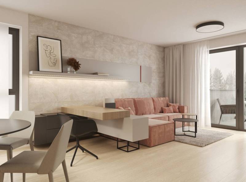 Obývací pokoj s béžovou stěnou, růžovou pohovkou a podlahou s dřevěným dekorem.