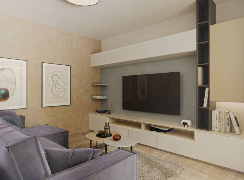 Interiér obývacího pokoje s pohodlnou pohovkou, televizí, obrazy a podlahou s dřevěným dekorem.