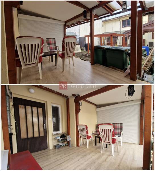 Zahrada rodinného domu na Laborecké ulici ve Spišské Nové Vsi s plastovým posezením.