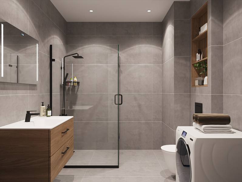 Koupelna se sprchovým koutem, umyvadlem, pračkou a poličkami v 1-pokojovém bytě.