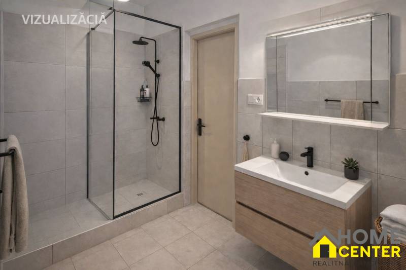 Koupelna v rodinném domě s moderním sprchovým koutem a umyvadlem s úložným prostorem.