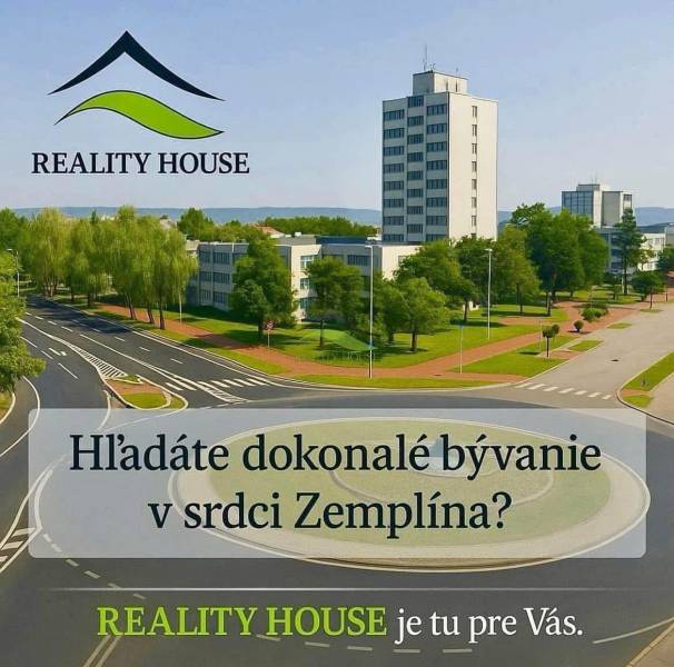 Kruhový objezd s budovami a parkovou zelení ve městě Hnojné, kategorie Pozemky - bydlení.