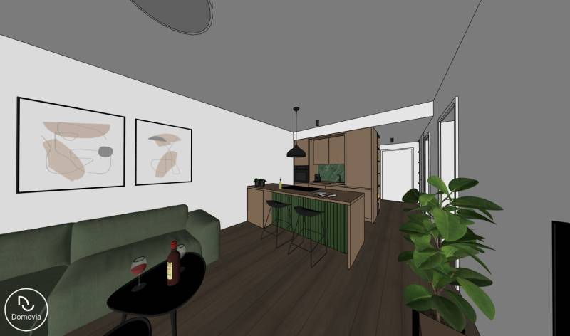 Obývací pokoj s kuchyní, zelená sedačka, jídelní kout, podlaha s dřevěným dekorem.