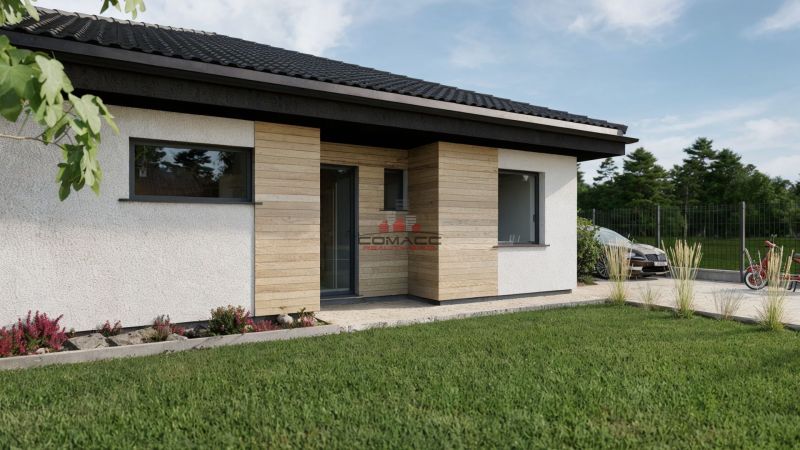 Rodinný dům na Kostelní ulici v Drahovcích s dřevěným obkladem a udržovanou zahradou.