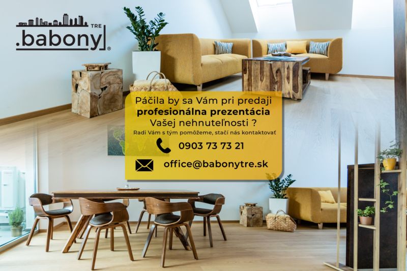 Obývací prostor s dřevěným stolem na ulici Okružní, vhodný pro Pozemky - bydlení.