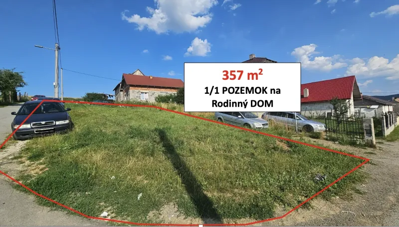Travnatý pozemek v Raslavicích s označením pro stavební účel - bydlení.