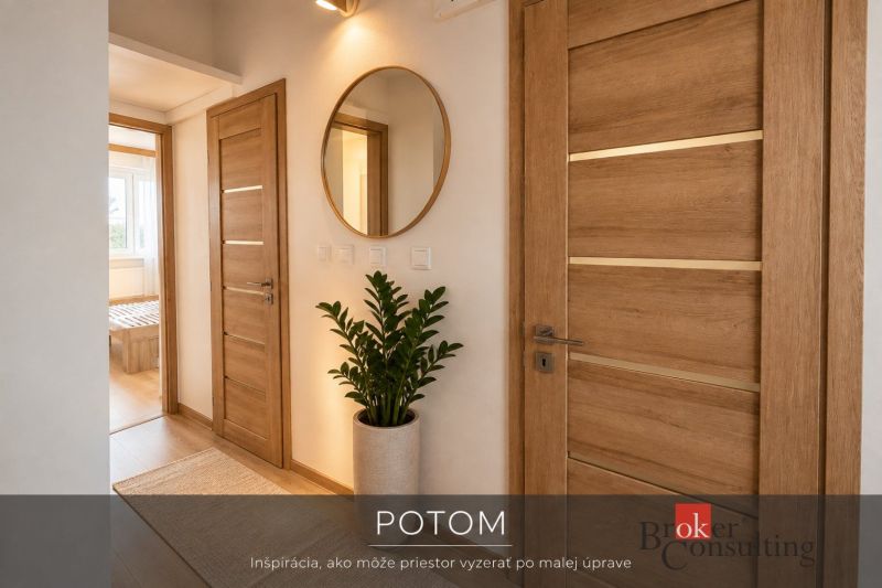 Koupelna v 3-pokojovém bytě s vanou, pračkou a vzorovanými obklady.