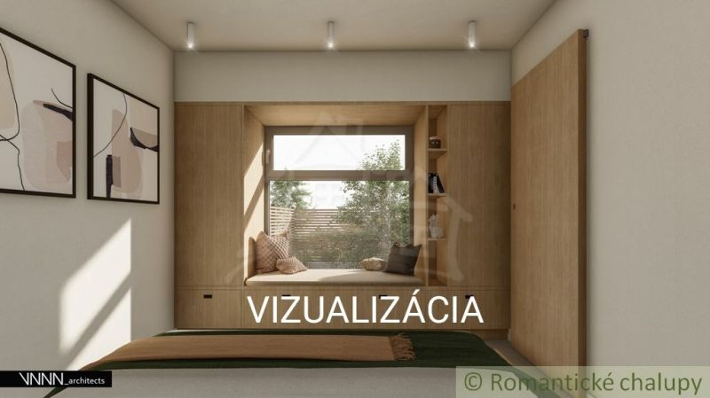 Interiér rodinného domu s útulným koutkem na sezení u okna.