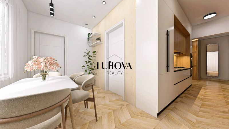 Interiér 2-pokojového bytu s podlahou s dřevěným dekorem a elegantním jídelním stolem.
