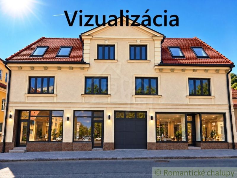 Fasáda budovy s obchodními prostory ve městě Modrý Kameň, zachycující prosklené výlohy.